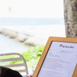 The Boat Shed Restaurant Woman Viewing Menu