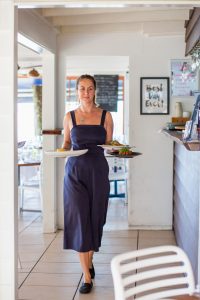 The Boat Shed Waitress Serving Food