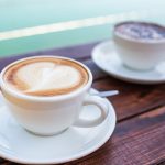 The Boatshed Two Coffes On Wooden Table