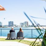 Couple Looking Out Onto Water